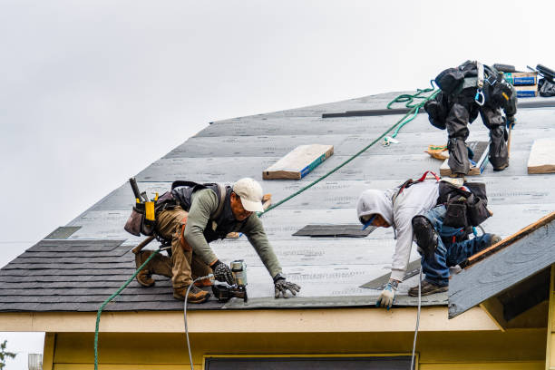 Professional Gutter Installation technician working in Woodmere, NY